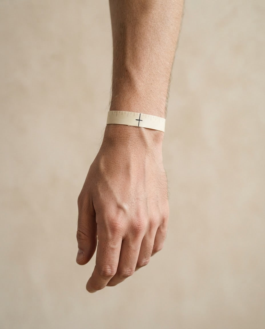 Wrap a strip of paper around your wrist and mark where it overlaps